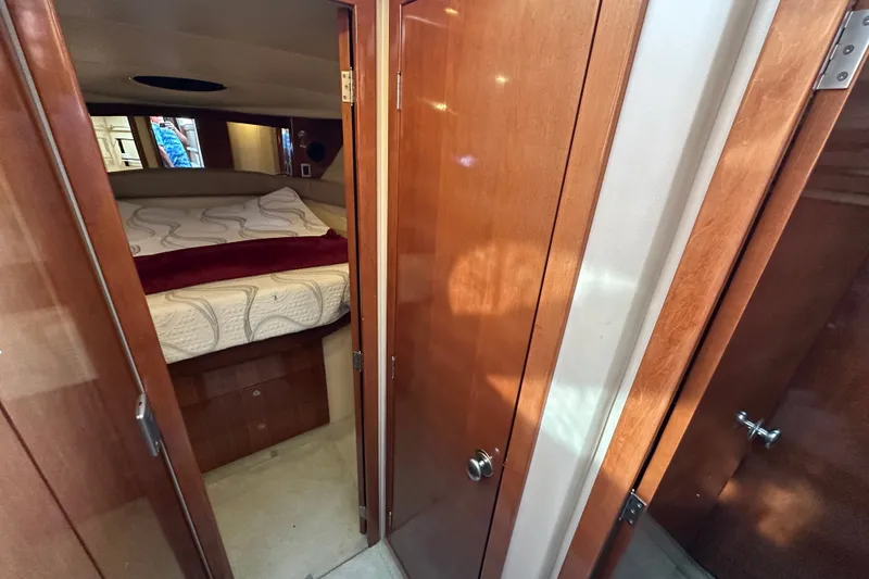 Slide: The Image of Interior cabin of 2007 Meridian 411 Sedan with bed and wooden doors. - 84