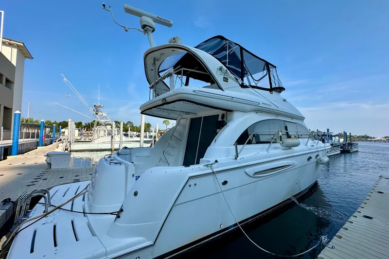 Slide: The Image of 2007 Meridian 411 Sedan yacht docked at marina under clear blue sky. - 18