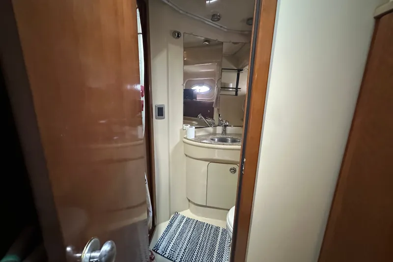 Slide: The Image of Interior of 2007 Meridian 411 Sedan yacht bathroom with sink and mirror. - 77