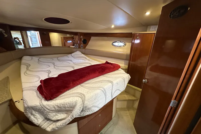Slide: The Image of Luxurious cabin interior of a 2007 Meridian 411 Sedan yacht with cozy bedding. - 96