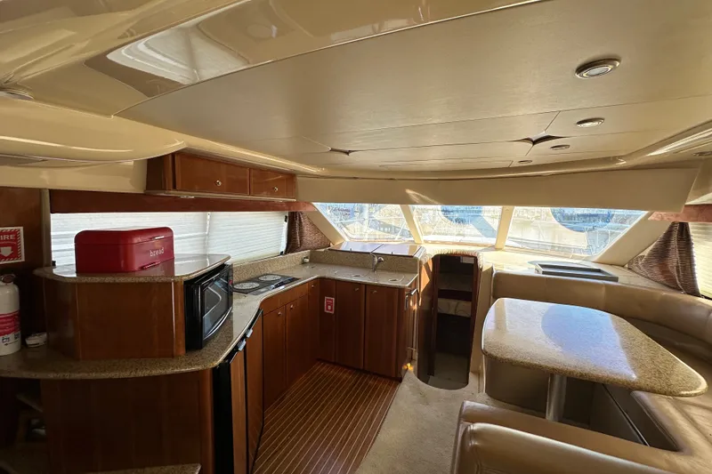 Slide: The Image of Luxurious interior of a 2007 Meridian 411 Sedan yacht with modern kitchen amenities. - 118