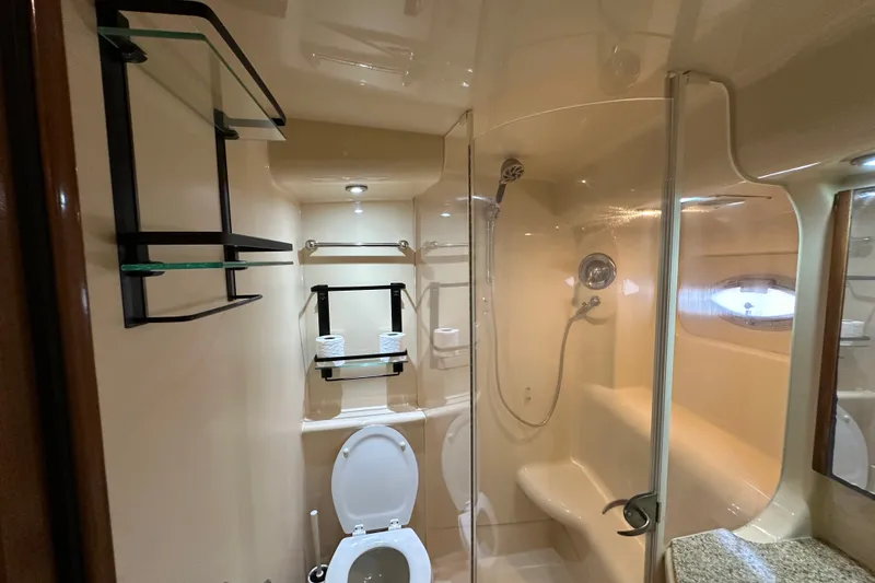 Slide: The Image of Luxurious bathroom in a 2007 Meridian 411 Sedan yacht with shower and toilet. - 106