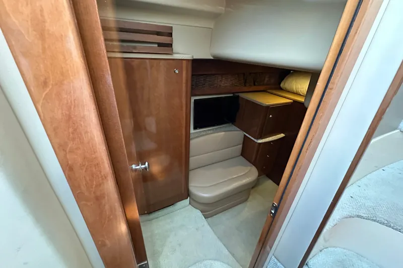 Slide: The Image of Interior cabin of 2007 Meridian 411 Sedan yacht with wood finishes and seating. - 69