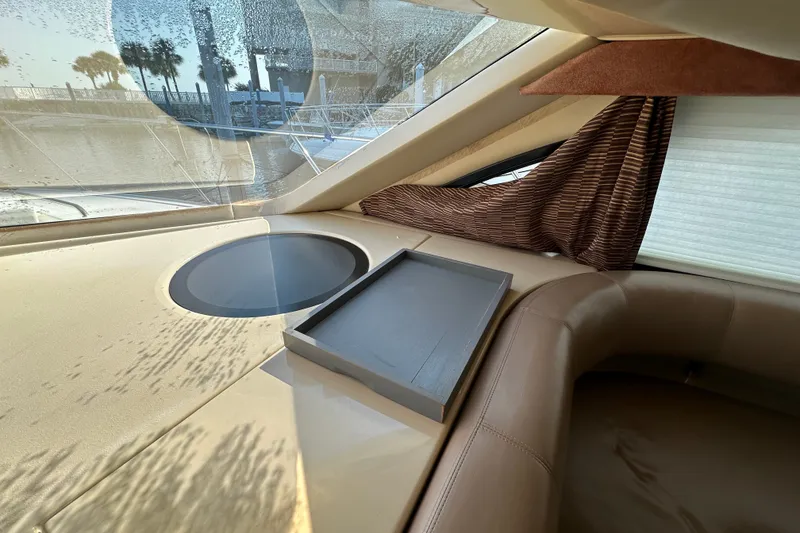 Slide: The Image of Interior of a 2007 Meridian 411 Sedan yacht with leather seating and window view. - 88