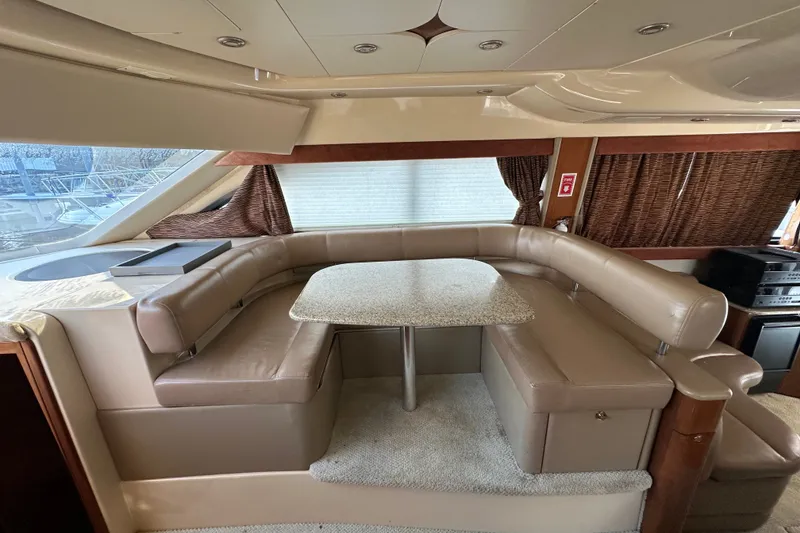 Slide: The Image of Luxurious interior of 2007 Meridian 411 Sedan yacht with plush seating and elegant table. - 54