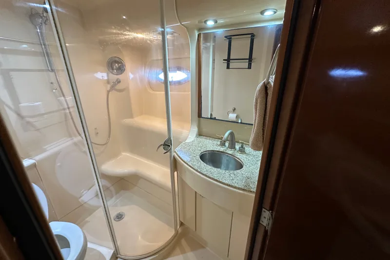 Slide: The Image of Luxurious bathroom in 2007 Meridian 411 Sedan yacht with shower and granite sink. - 104