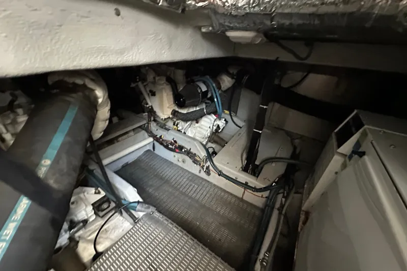 Slide: The Image of Engine room of a 2007 Meridian 411 Sedan, showcasing mechanical components and wiring. - 128