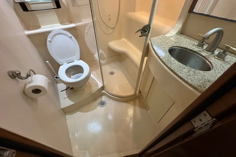Slide: The Image of Compact bathroom in 2007 Meridian 411 Sedan yacht with shower, toilet, and sink. - 109