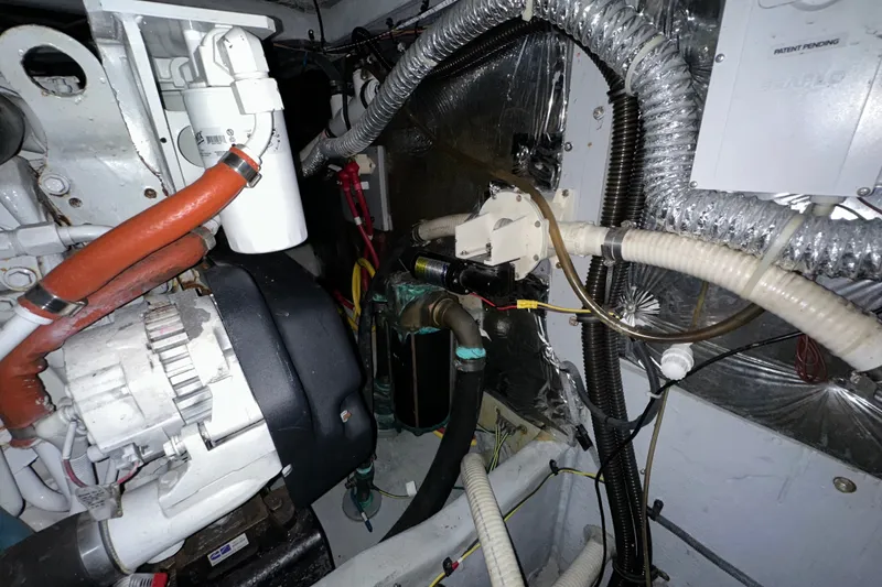 Slide: The Image of Engine room of a 2007 Meridian 411 Sedan with visible mechanical components and wiring. - 139