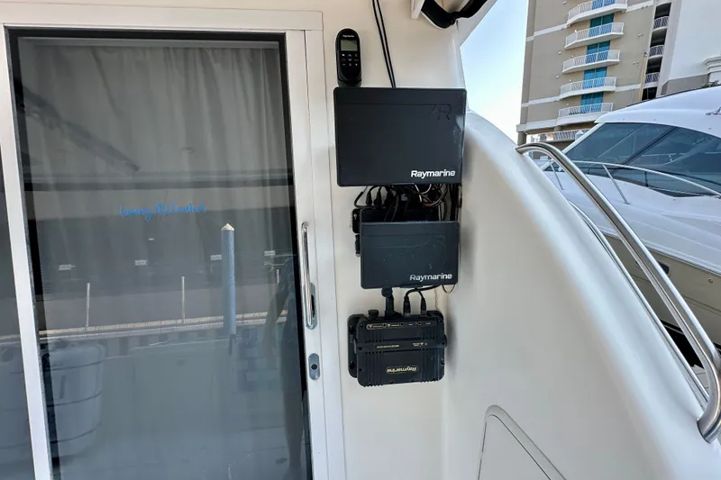 Slide: The Image of 2007 Meridian 411 Sedan yacht with Raymarine navigation equipment installed near sliding door. - 39