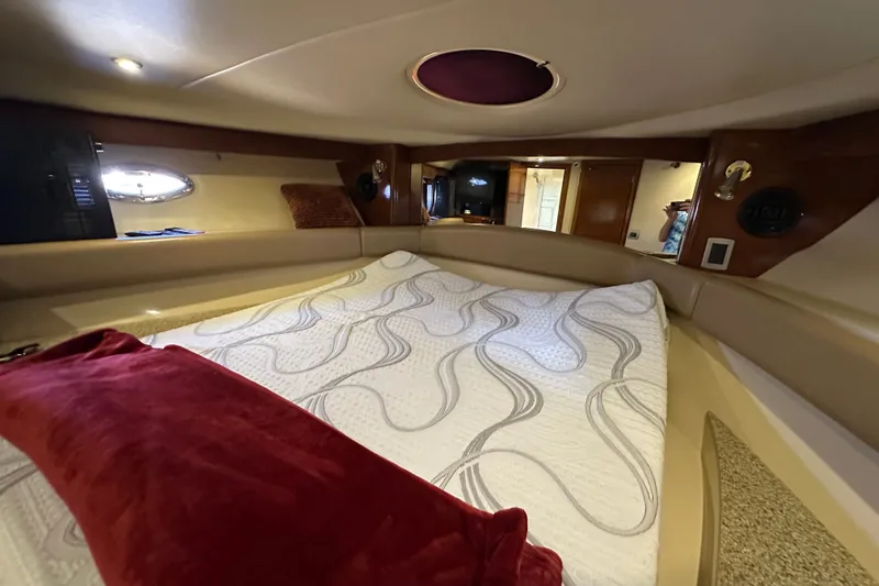 Slide: The Image of Luxurious cabin interior of a 2007 Meridian 411 Sedan yacht with elegant bedding. - 101