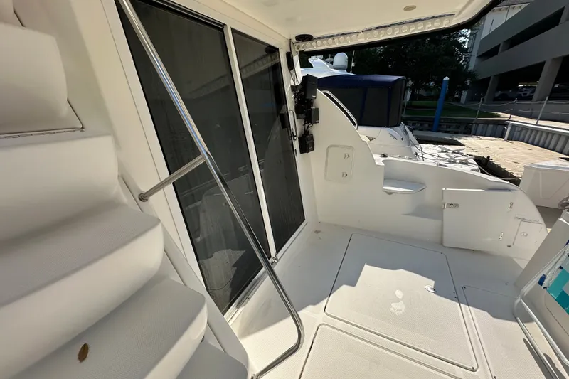 Slide: The Image of 2007 Meridian 411 Sedan yacht deck with stairs and sliding glass door. - 62