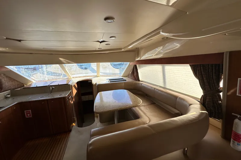 Slide: The Image of Luxurious interior of a 2007 Meridian 411 Sedan yacht with spacious seating and elegant design. - 122