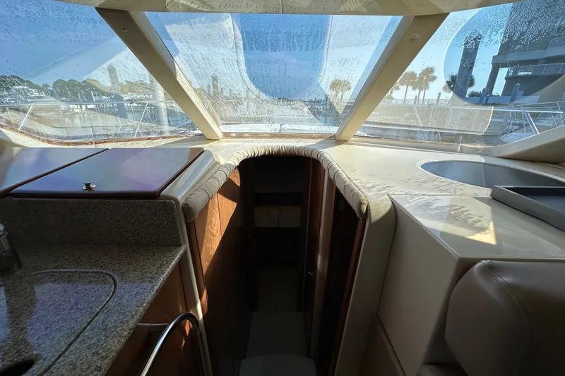 Slide: The Image of Interior view of 2007 Meridian 411 Sedan yacht with sunlit cabin and sleek design. - 89