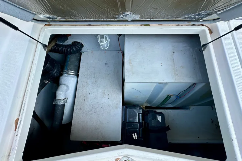 Slide: The Image of Engine compartment of a 2007 Meridian 411 Sedan, showing mechanical components and wiring. - 36