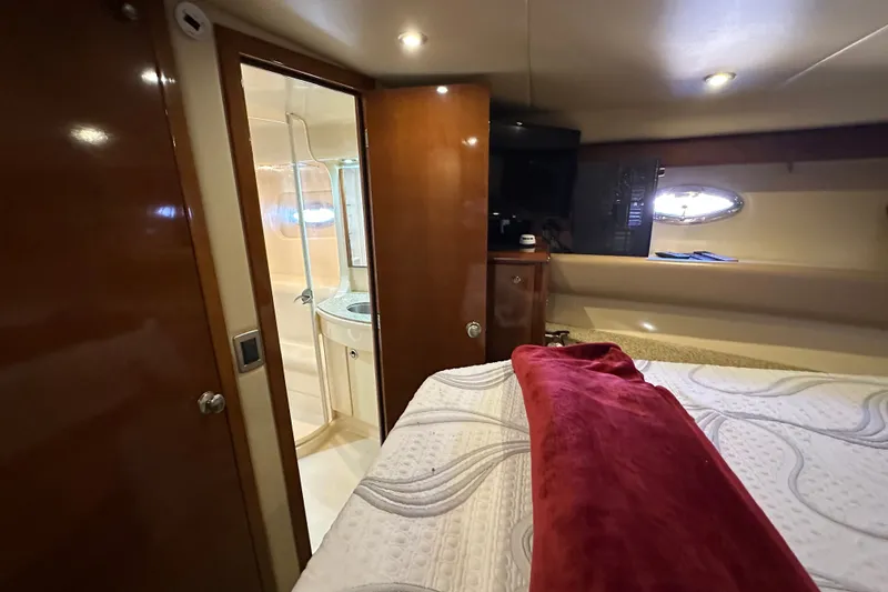Slide: The Image of Luxurious interior of 2007 Meridian 411 Sedan yacht with cozy bedroom and ensuite bathroom. - 102
