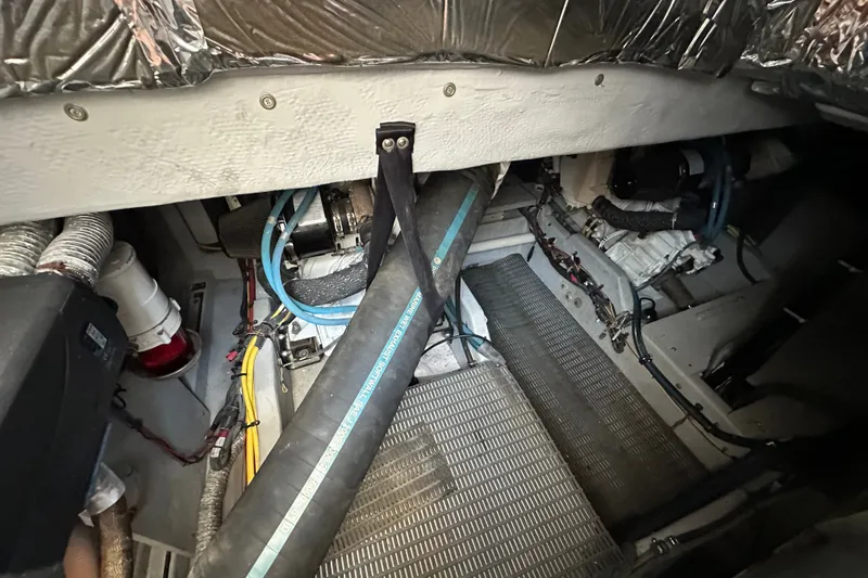 Slide: The Image of Engine room of a 2007 Meridian 411 Sedan with visible hoses and wiring. - 127