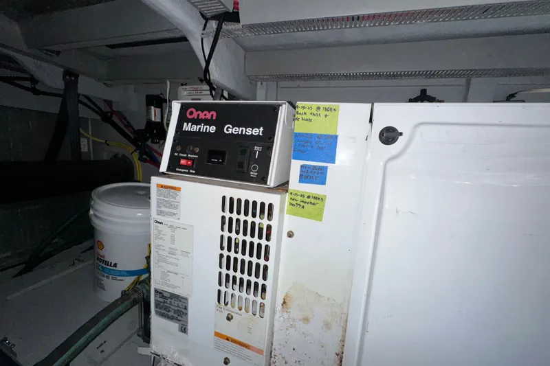 Slide: The Image of Onan Marine Genset in 2007 Meridian 411 Sedan engine room with maintenance notes. - 130
