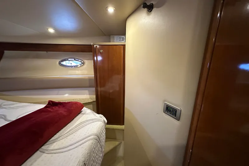 Slide: The Image of Luxurious interior of 2007 Meridian 411 Sedan yacht cabin with cozy bedding. - 98