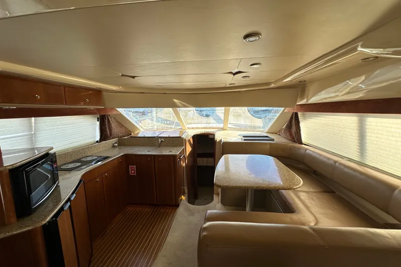 Slide: The Image of Interior of 2007 Meridian 411 Sedan yacht with kitchen and dining area. - 121