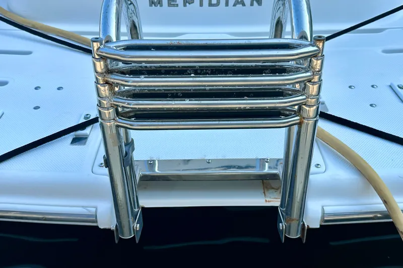 Slide: The Image of Chrome ladder on a 2007 Meridian 411 Sedan yacht deck. - 23