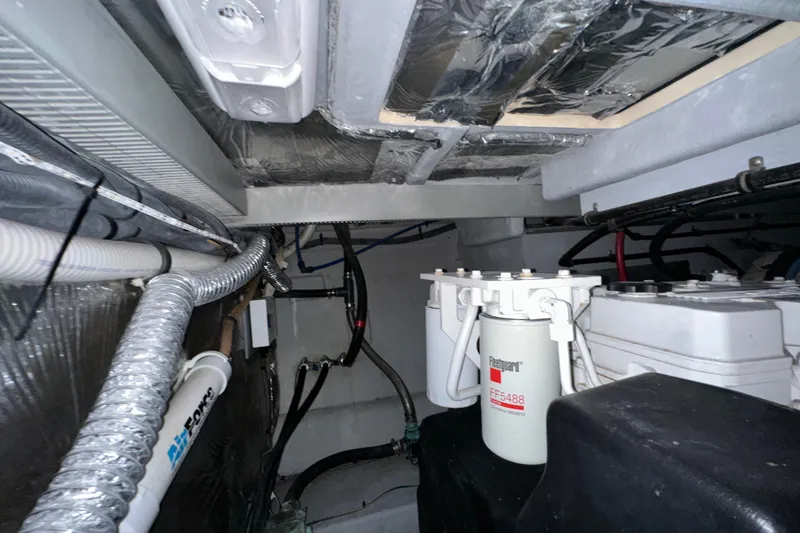 Slide: The Image of Engine room of a 2007 Meridian 411 Sedan with visible filters and wiring. - 142