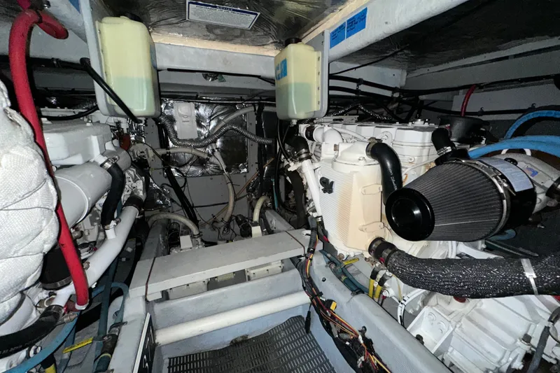 Slide: The Image of Engine room of a 2007 Meridian 411 Sedan yacht, showcasing mechanical components. - 134