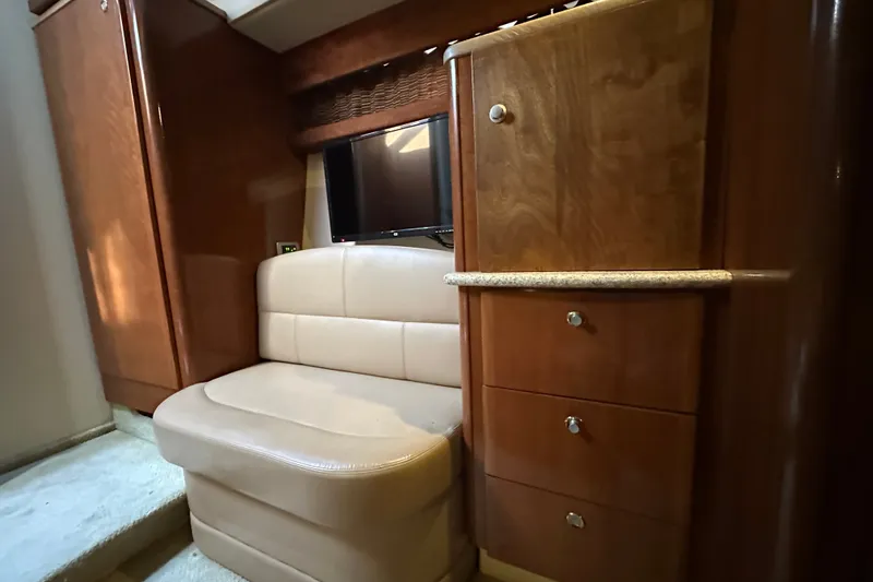 Slide: The Image of Luxurious interior of 2007 Meridian 411 Sedan with wood cabinetry and beige seating. - 71