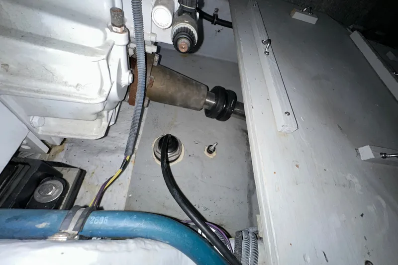 Slide: The Image of Engine compartment of a 2007 Meridian 411 Sedan, showcasing mechanical components and wiring. - 144
