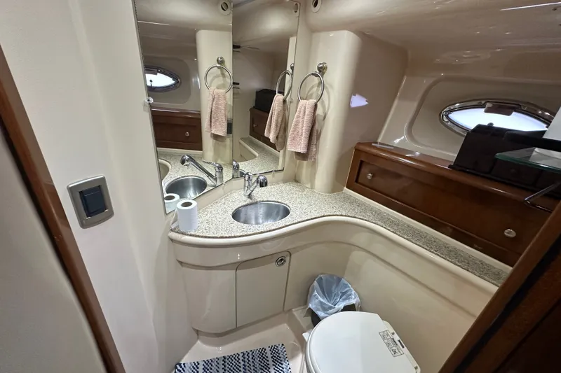 Slide: The Image of Luxurious bathroom in a 2007 Meridian 411 Sedan yacht, featuring elegant fixtures and ample storage. - 78