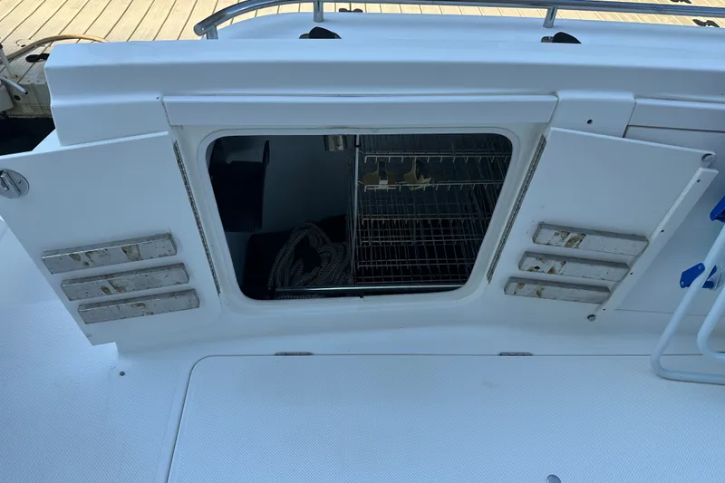 Slide: The Image of Open storage compartment on a 2007 Meridian 411 Sedan boat deck. - 29