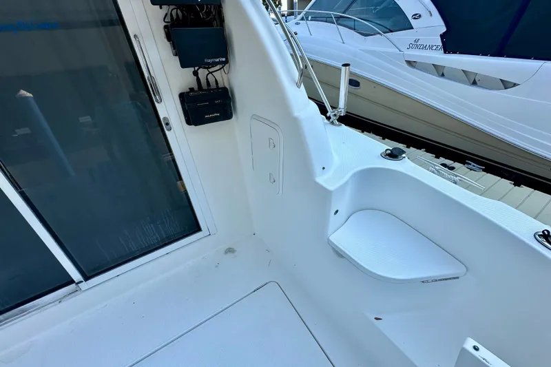 Slide: The Image of 2007 Meridian 411 Sedan yacht deck with navigation equipment and adjacent docked boat. - 38