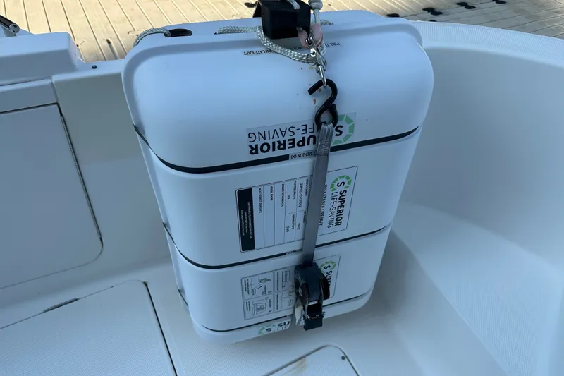 Slide: The Image of Life-saving equipment on 2007 Meridian 411 Sedan boat, secured with straps. - 32