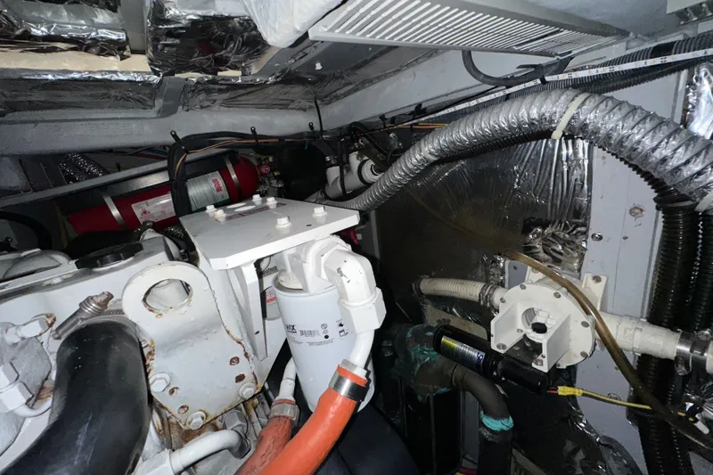 Slide: The Image of Engine room of a 2007 Meridian 411 Sedan with visible hoses and components. - 141