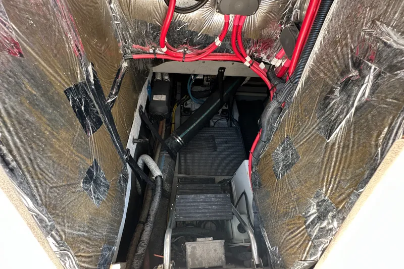 Slide: The Image of Engine room of a 2007 Meridian 411 Sedan with visible wiring and insulation. - 112