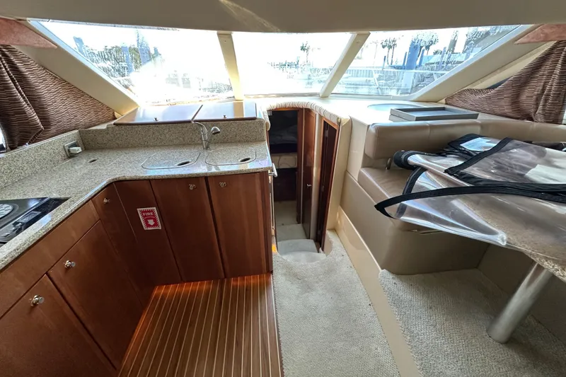 Slide: The Image of Interior of 2007 Meridian 411 Sedan yacht with modern kitchen and seating area. - 53
