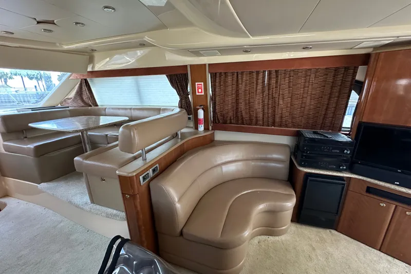 Slide: The Image of Luxurious interior of a 2007 Meridian 411 Sedan yacht with leather seating and entertainment area. - 55