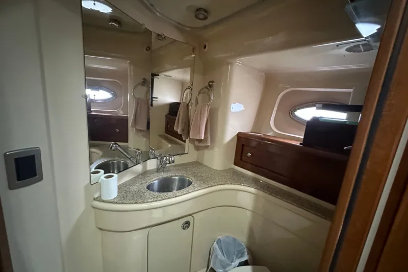 Slide: The Image of Luxurious bathroom in a 2007 Meridian 411 Sedan yacht, featuring elegant fixtures and ample storage. - 80