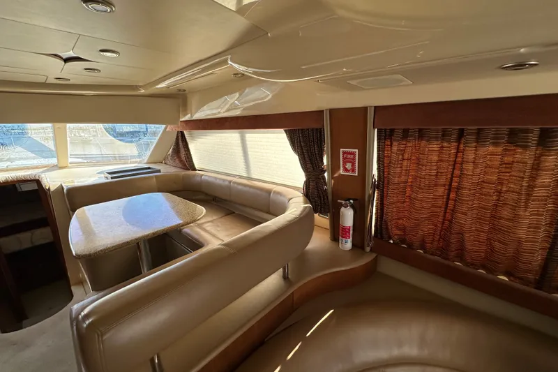 Slide: The Image of Luxurious interior of a 2007 Meridian 411 Sedan yacht with leather seating and dining area. - 123