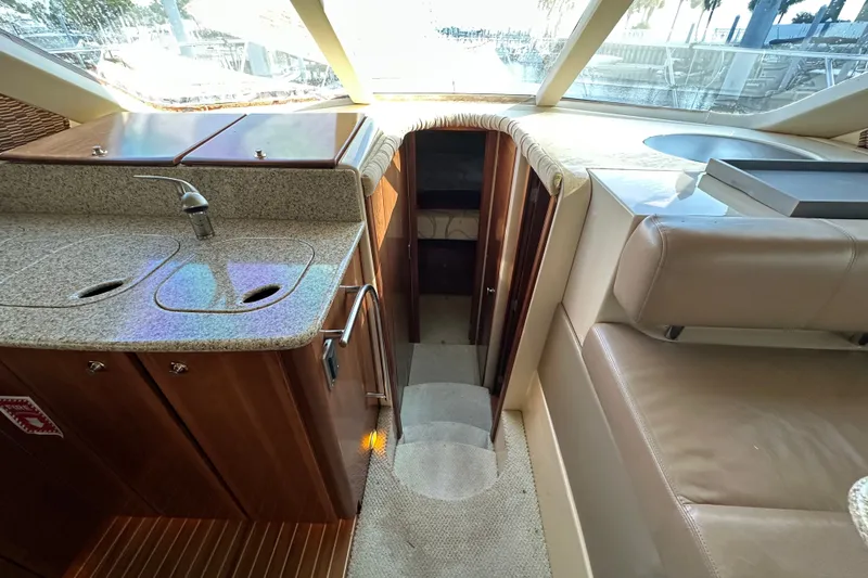 Slide: The Image of Interior of 2007 Meridian 411 Sedan yacht with kitchenette and seating area. - 59