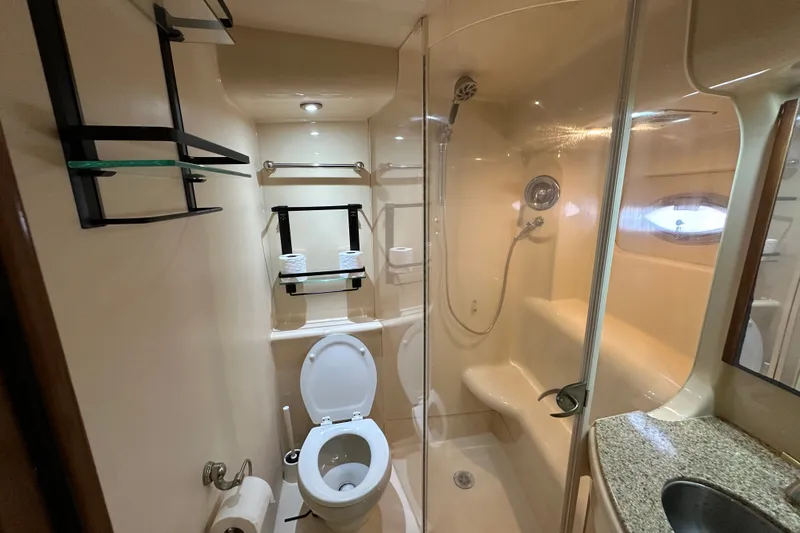 Slide: The Image of Luxurious bathroom in 2007 Meridian 411 Sedan yacht with shower and toilet. - 105