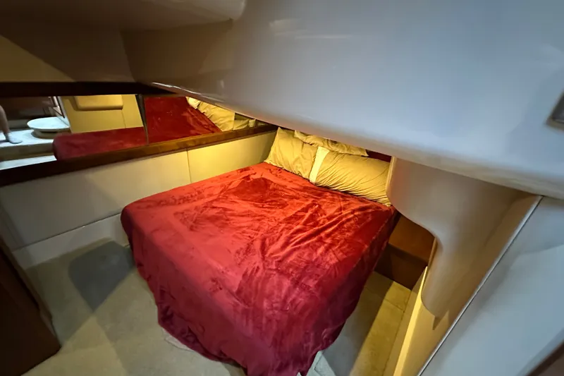 Slide: The Image of Luxurious cabin interior of 2007 Meridian 411 Sedan with red bedding. - 70