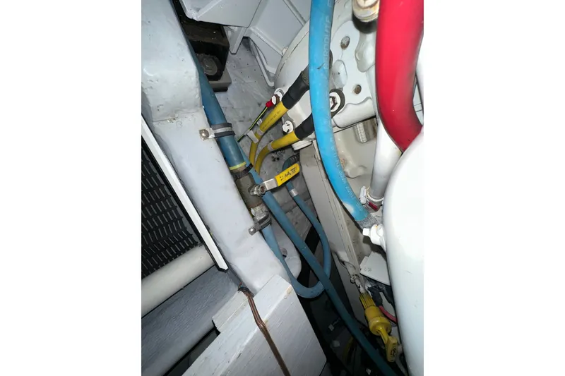 Slide: The Image of Engine compartment of a 2007 Meridian 411 Sedan with visible hoses and wiring. - 140