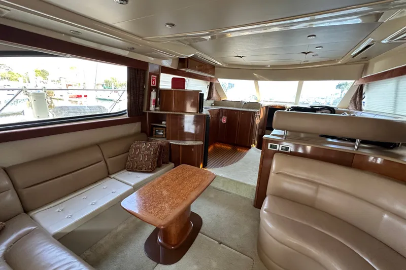 Slide: The Image of Luxurious interior of a 2007 Meridian 411 Sedan yacht with plush seating and wooden accents. - 47