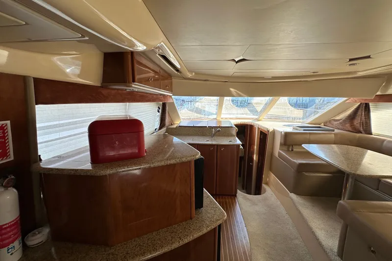 Slide: The Image of Luxurious interior of a 2007 Meridian 411 Sedan yacht with elegant wood finishes. - 120