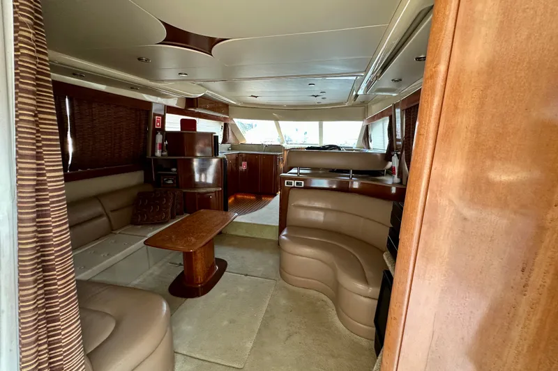Slide: The Image of Luxurious interior of a 2007 Meridian 411 Sedan yacht with elegant wood finishes. - 43