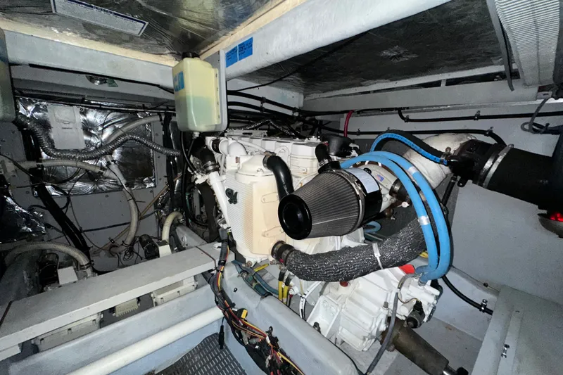 Slide: The Image of Engine room of a 2007 Meridian 411 Sedan yacht, showcasing mechanical components. - 133