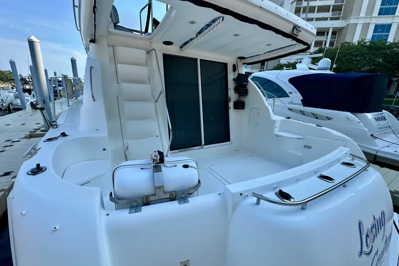 Slide: The Image of 2007 Meridian 411 Sedan yacht docked at marina, featuring spacious deck and modern design. - 31