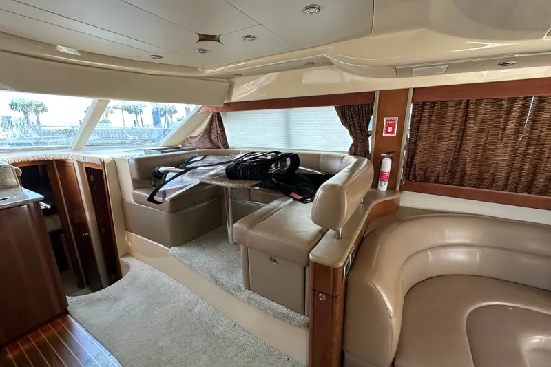 Slide: The Image of Luxurious interior of a 2007 Meridian 411 Sedan yacht with leather seating and large windows. - 49