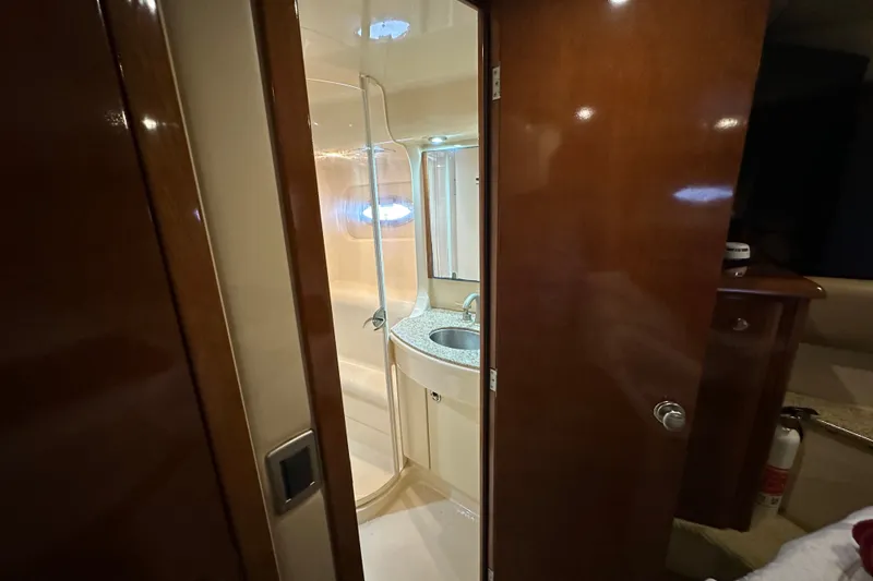 Slide: The Image of Luxurious bathroom interior of 2007 Meridian 411 Sedan yacht with wooden finishes. - 103